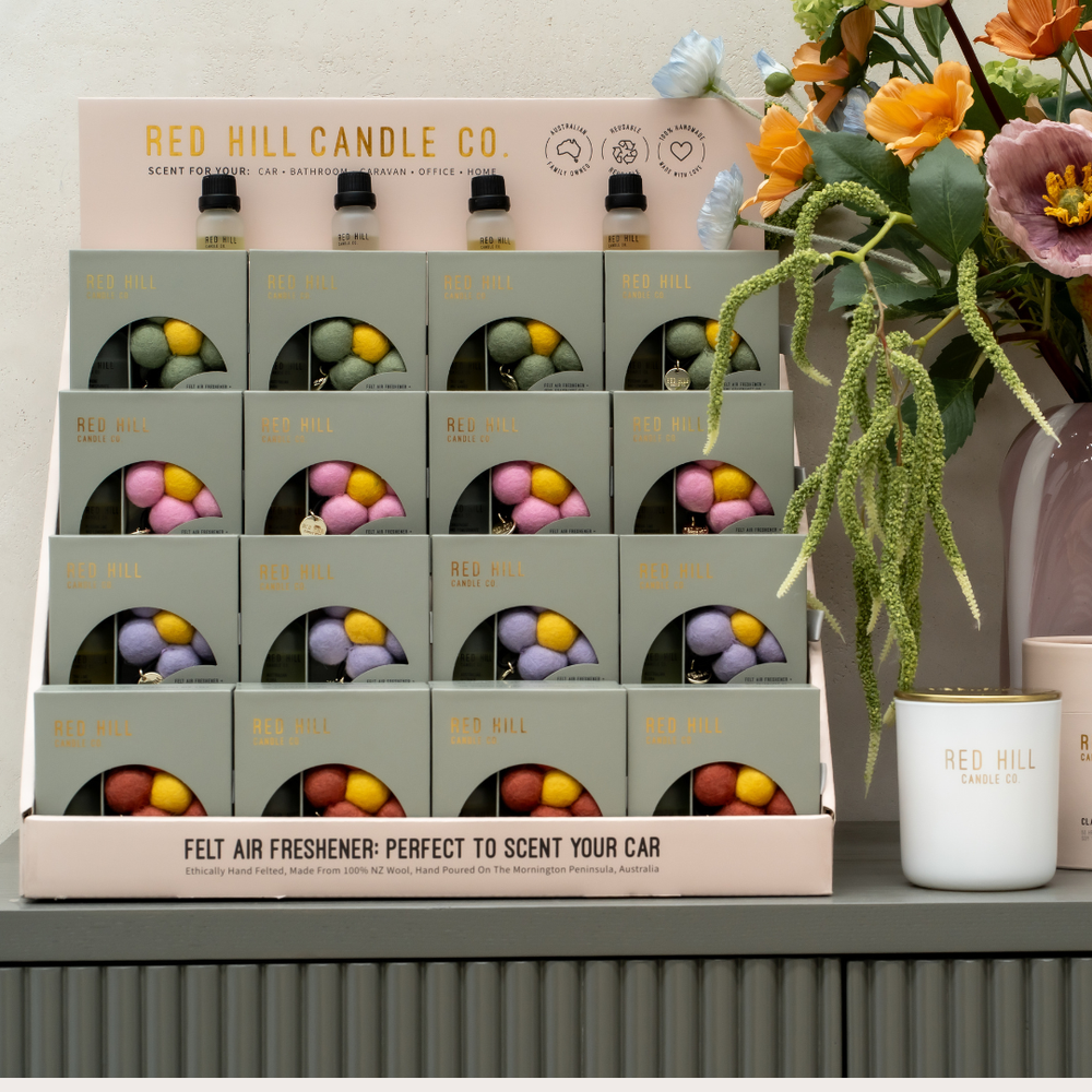 Display of Red Hill Candle Co Felt air fresheners.