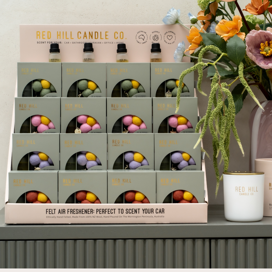 Display of Red Hill Candle Co Felt air fresheners.
